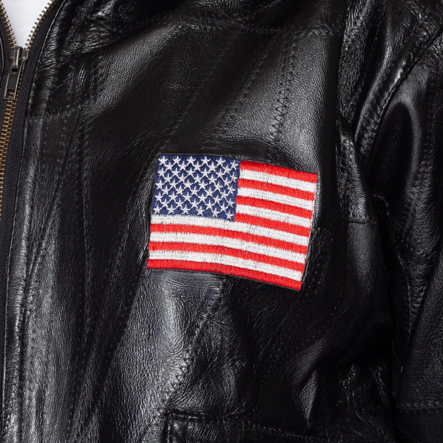 Medium 90s Black Patchwork Leather American Flag Moto Jacket | Vintage Eagle Patch Zip Up Motorcycle Biker Coat