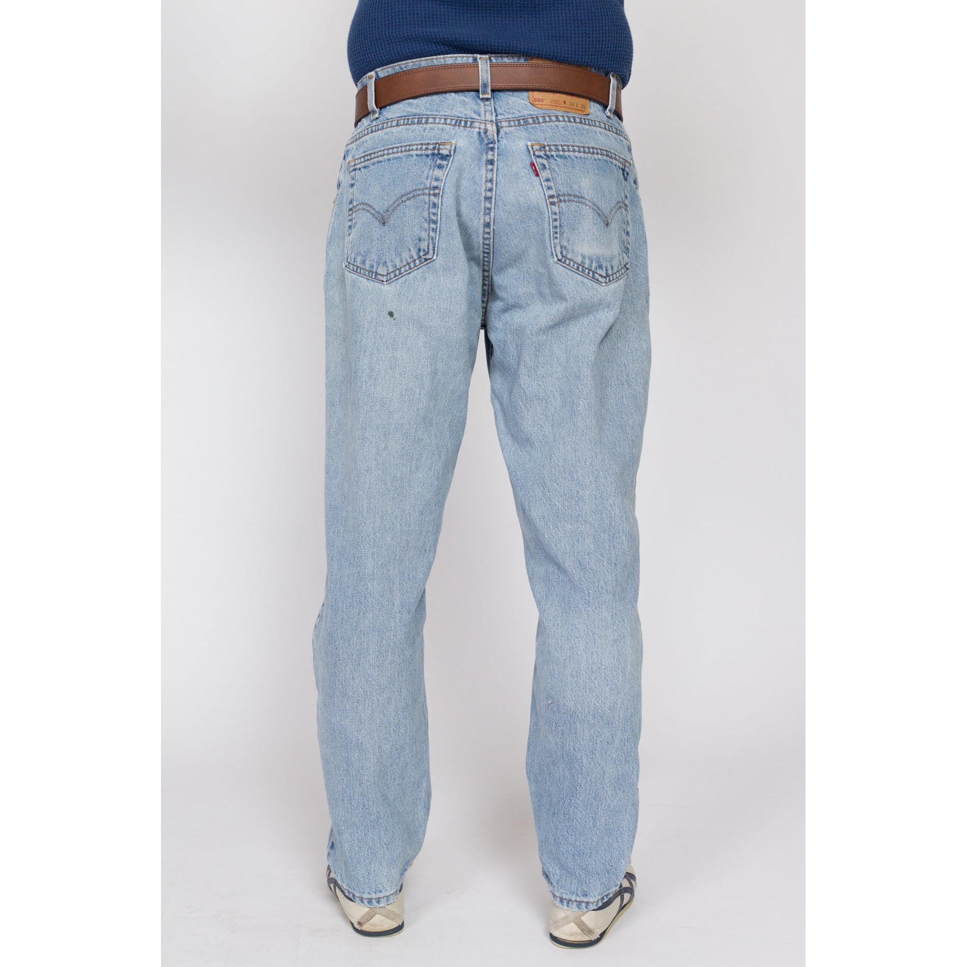 34x30 Vintage Levis 560 Made In USA Faded Light Wash Jeans | 80s 90s Levi's Distressed Tapered Leg Denim Dad Jeans