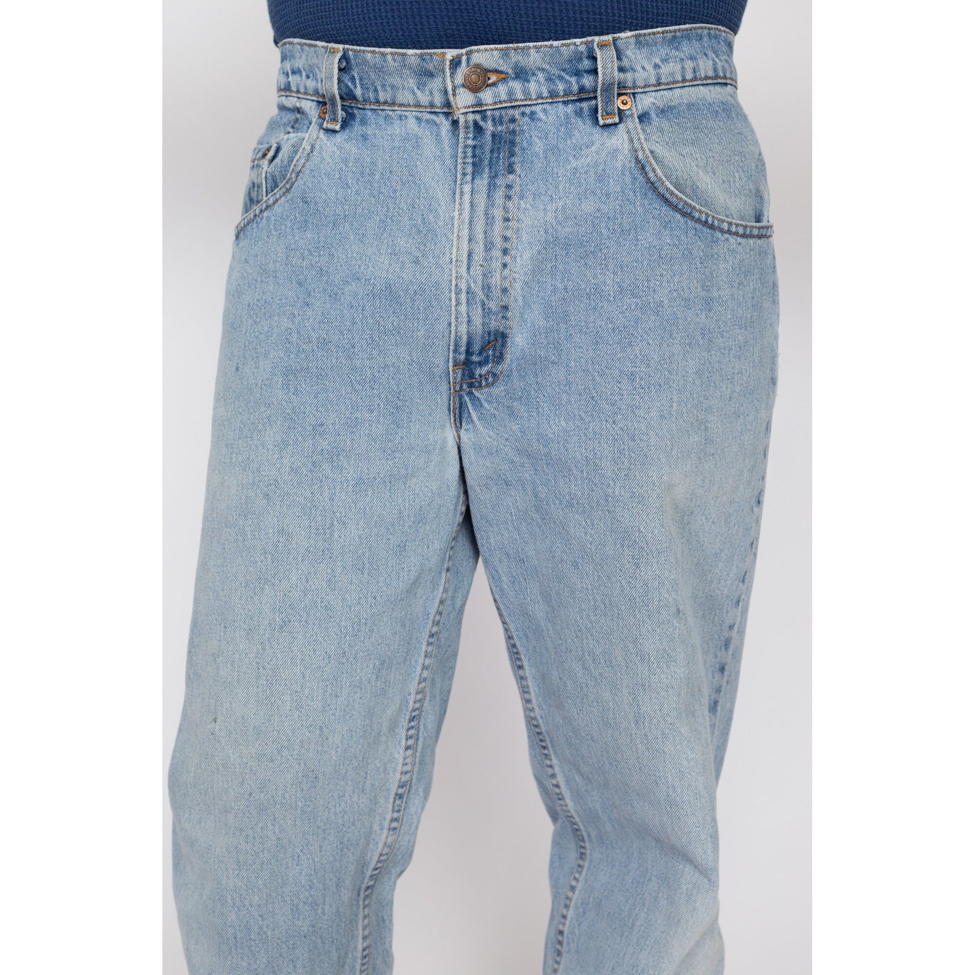 34x30 Vintage Levis 560 Made In USA Faded Light Wash Jeans | 80s 90s Levi's Distressed Tapered Leg Denim Dad Jeans