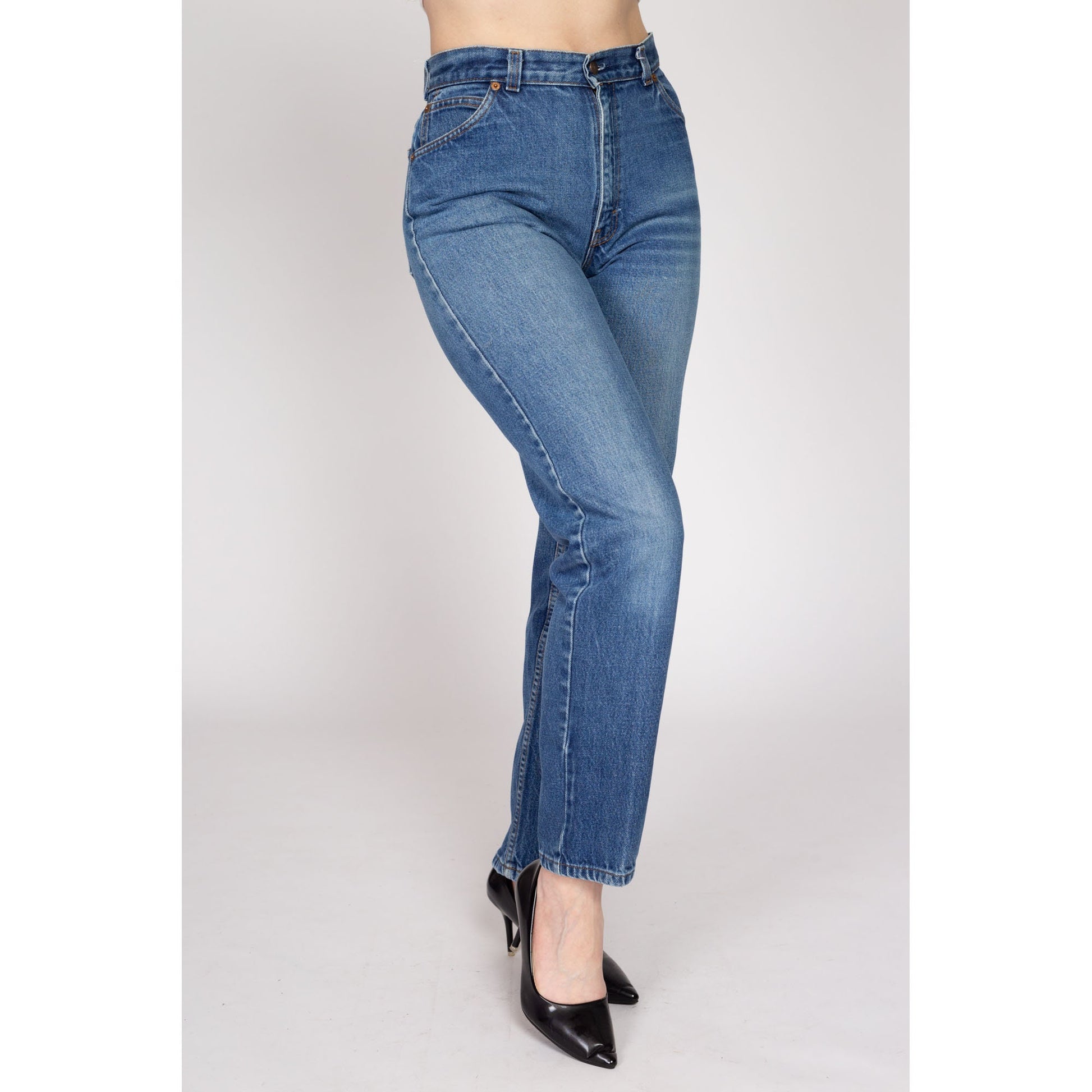 Medium 80s Levis White Tab High Waisted Jeans 28" | Vintage Levi's Medium Wash Denim Tapered Leg Mom Jeans