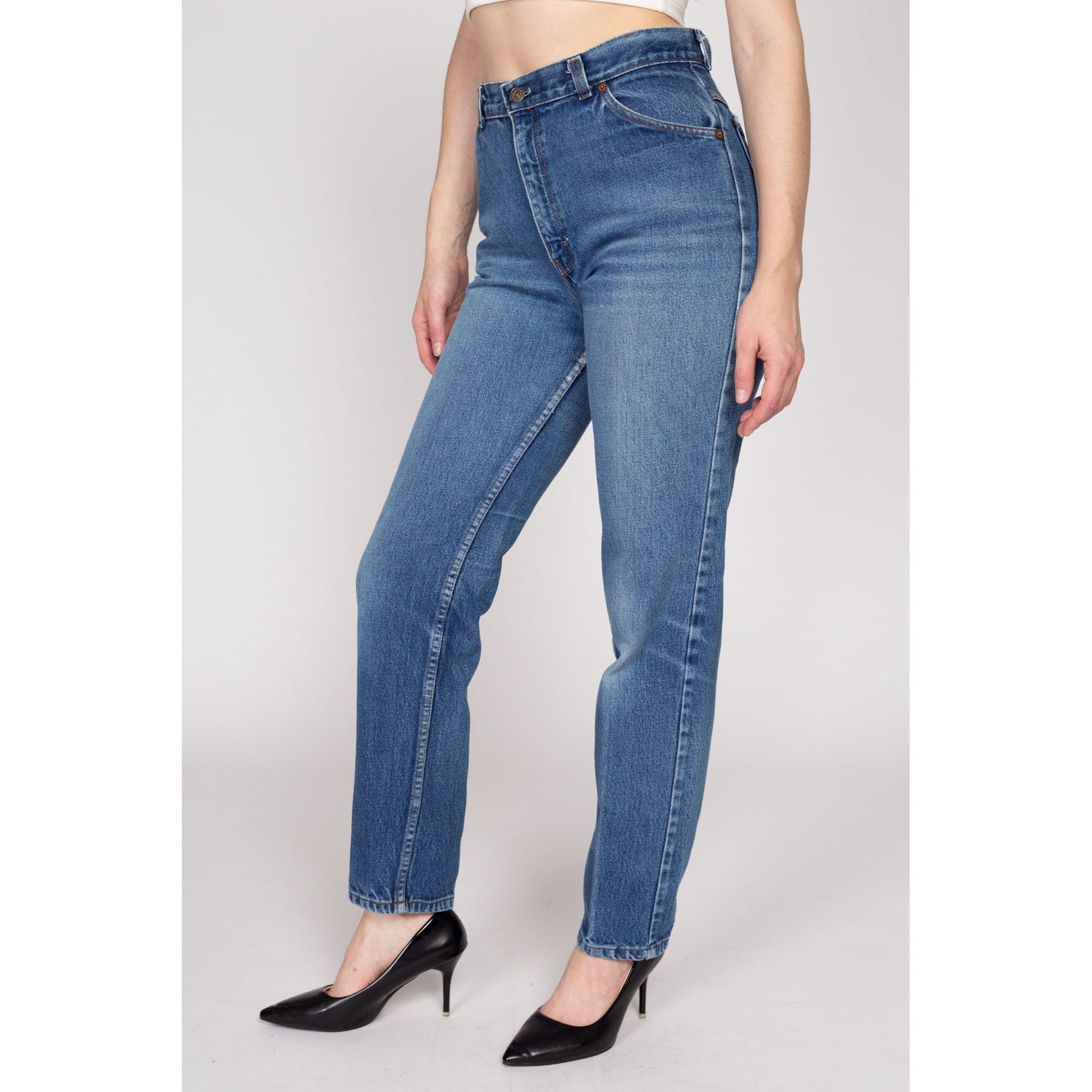 Medium 80s Levis White Tab High Waisted Jeans 28" | Vintage Levi's Medium Wash Denim Tapered Leg Mom Jeans