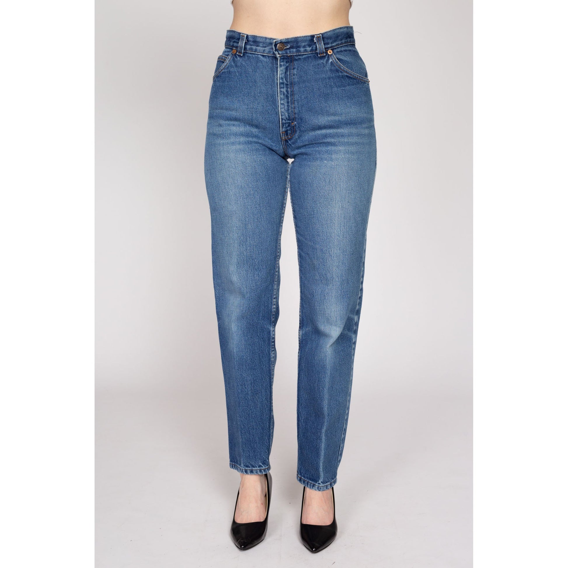 Medium 80s Levis White Tab High Waisted Jeans 28" | Vintage Levi's Medium Wash Denim Tapered Leg Mom Jeans