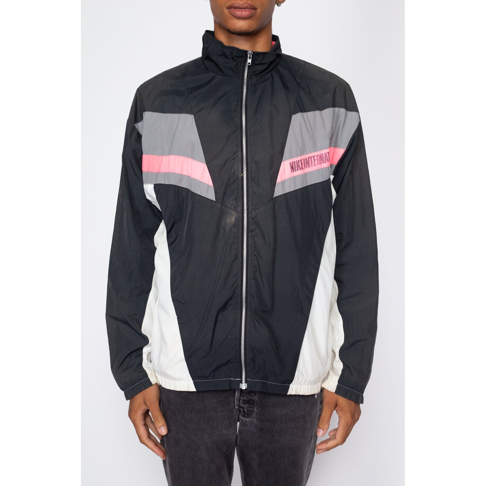 Large 90s Nike International Faded Color Block Windbreaker | Vintage Distressed Streetwear Swoosh Logo Track Jacket