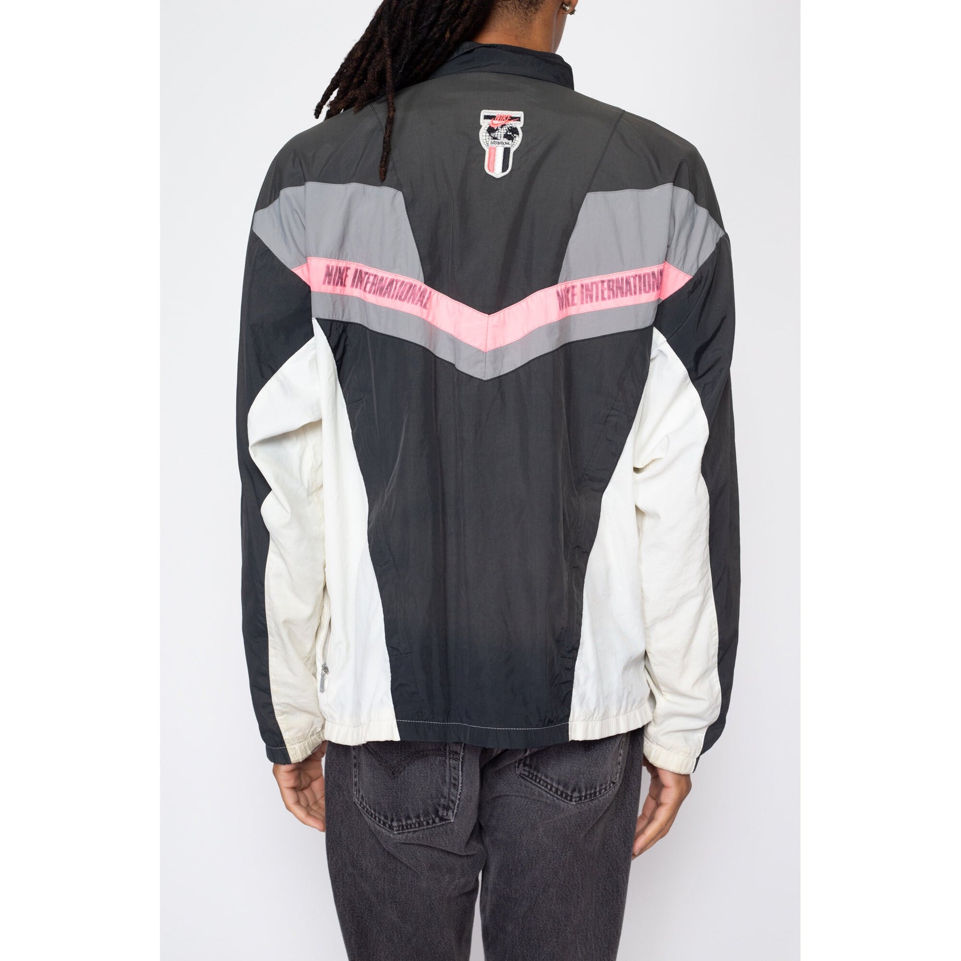 Large 90s Nike International Faded Color Block Windbreaker | Vintage Distressed Streetwear Swoosh Logo Track Jacket